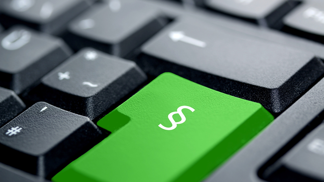 Tastatur mit einer grünen Taste auf der ein Paragraphenzeichen abgebildet ist (verweist auf: Hintergrundinformationen)